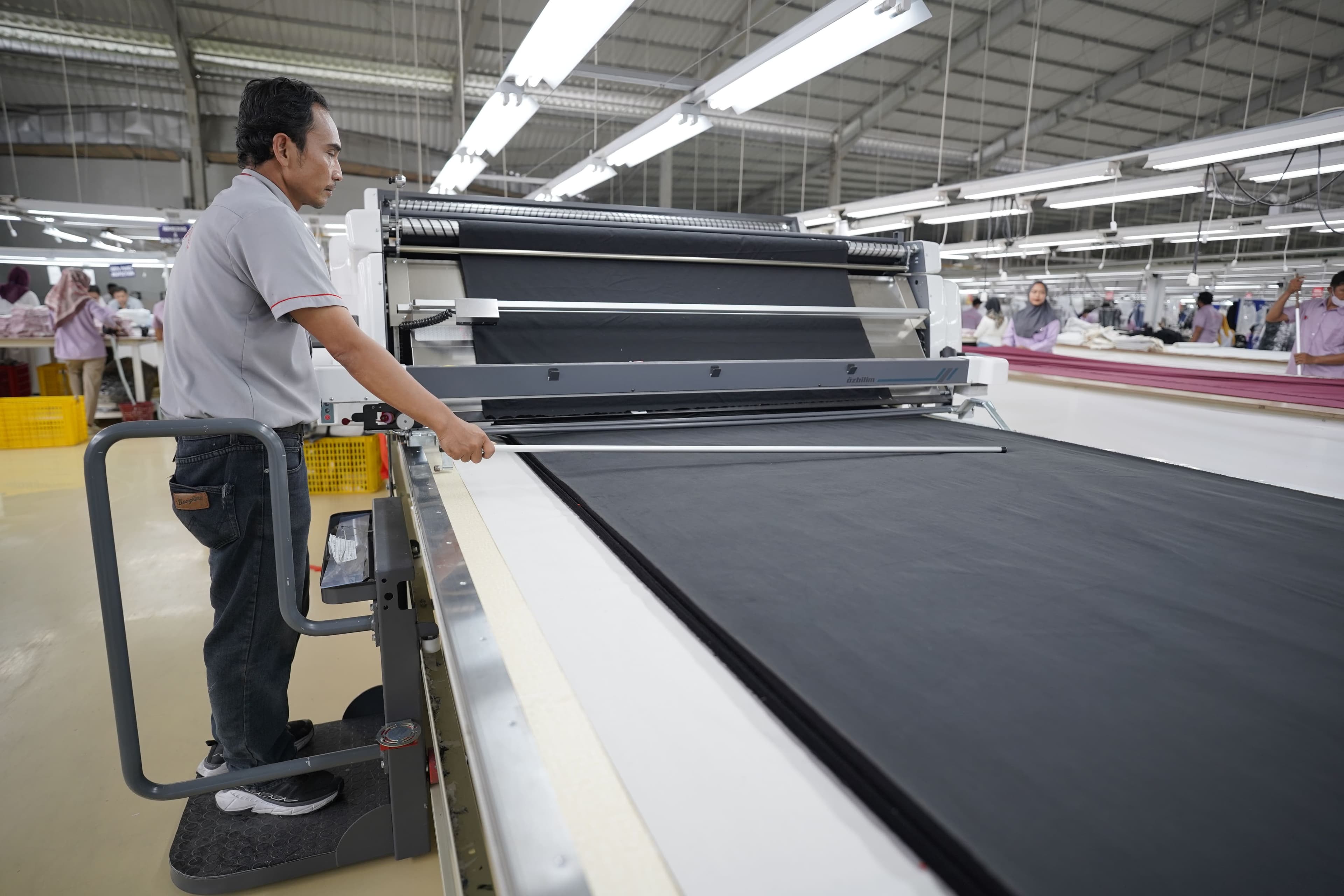 Precision fabric cutting at Modelama Indonesia facility